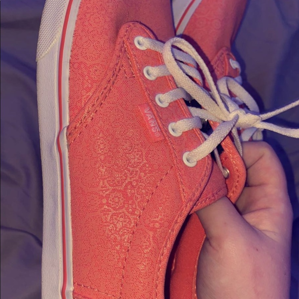 Coral colored vans with cute design